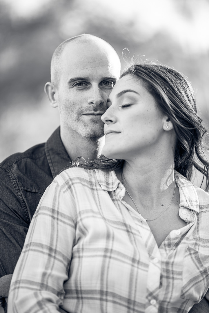 Couple sharing a quiet embrace in black and white