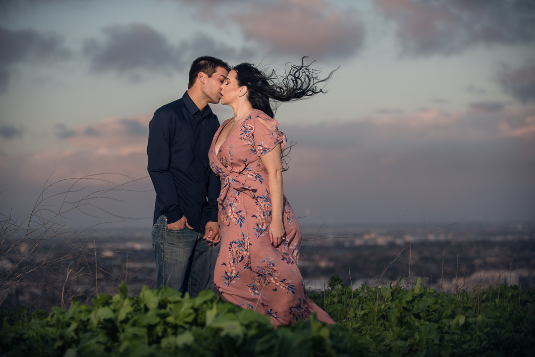 Couple kissing in the coastal wind