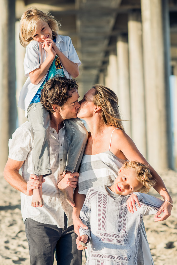 Family sharing a playful moment on the beach