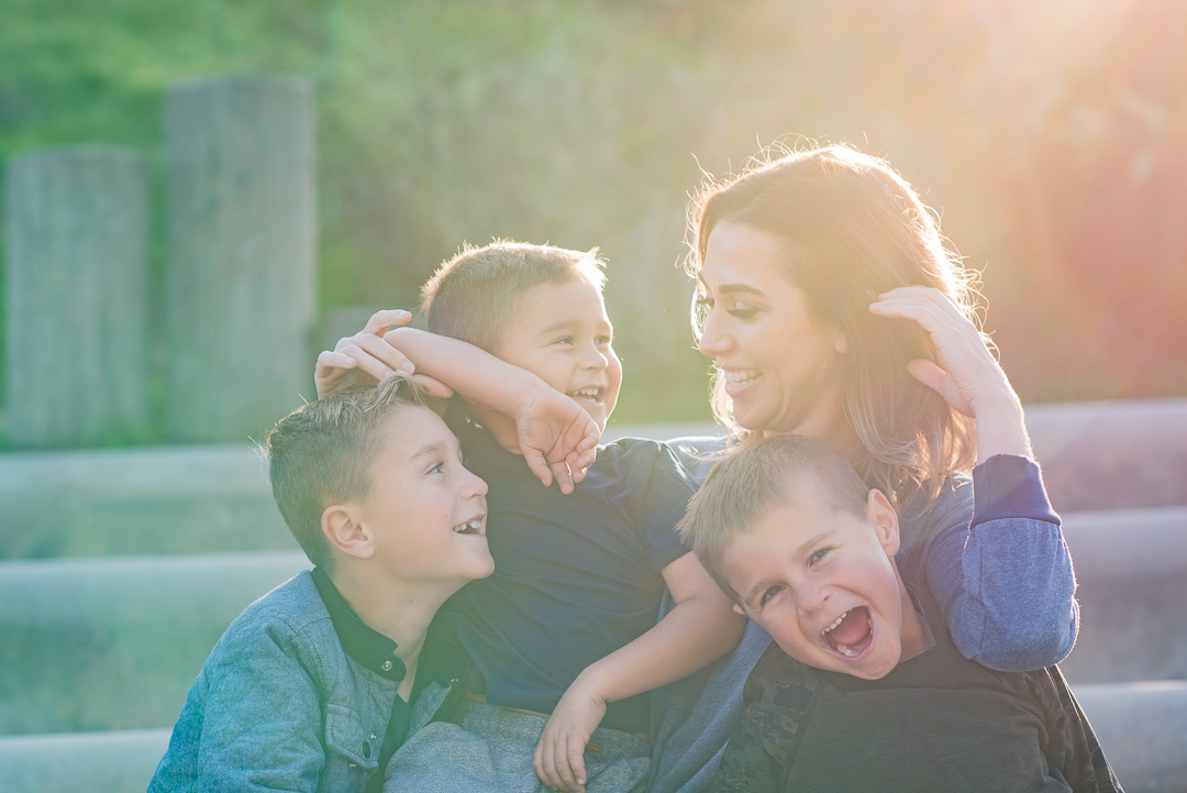Mother laughing with her three sons