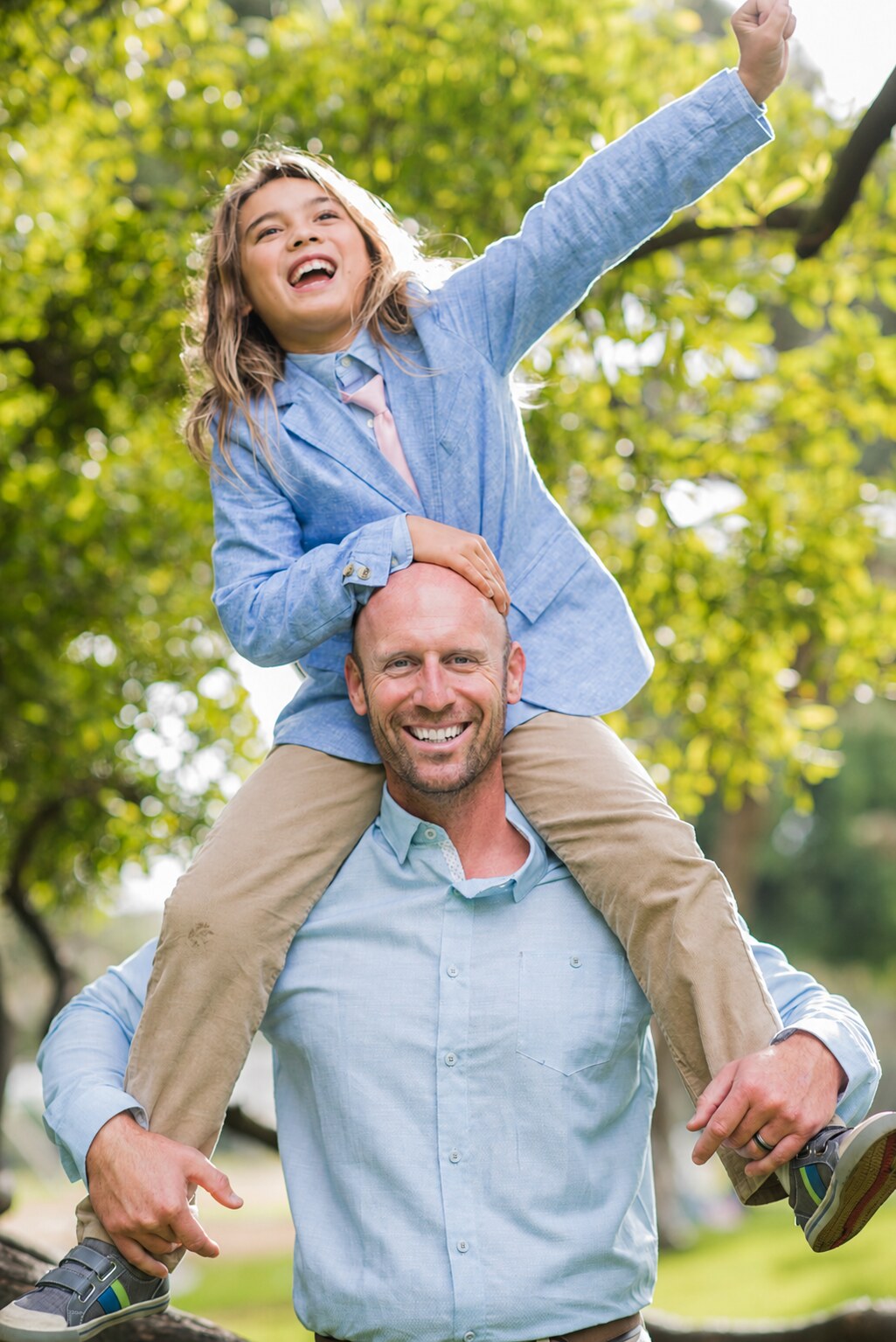 Father carrying his laughing child